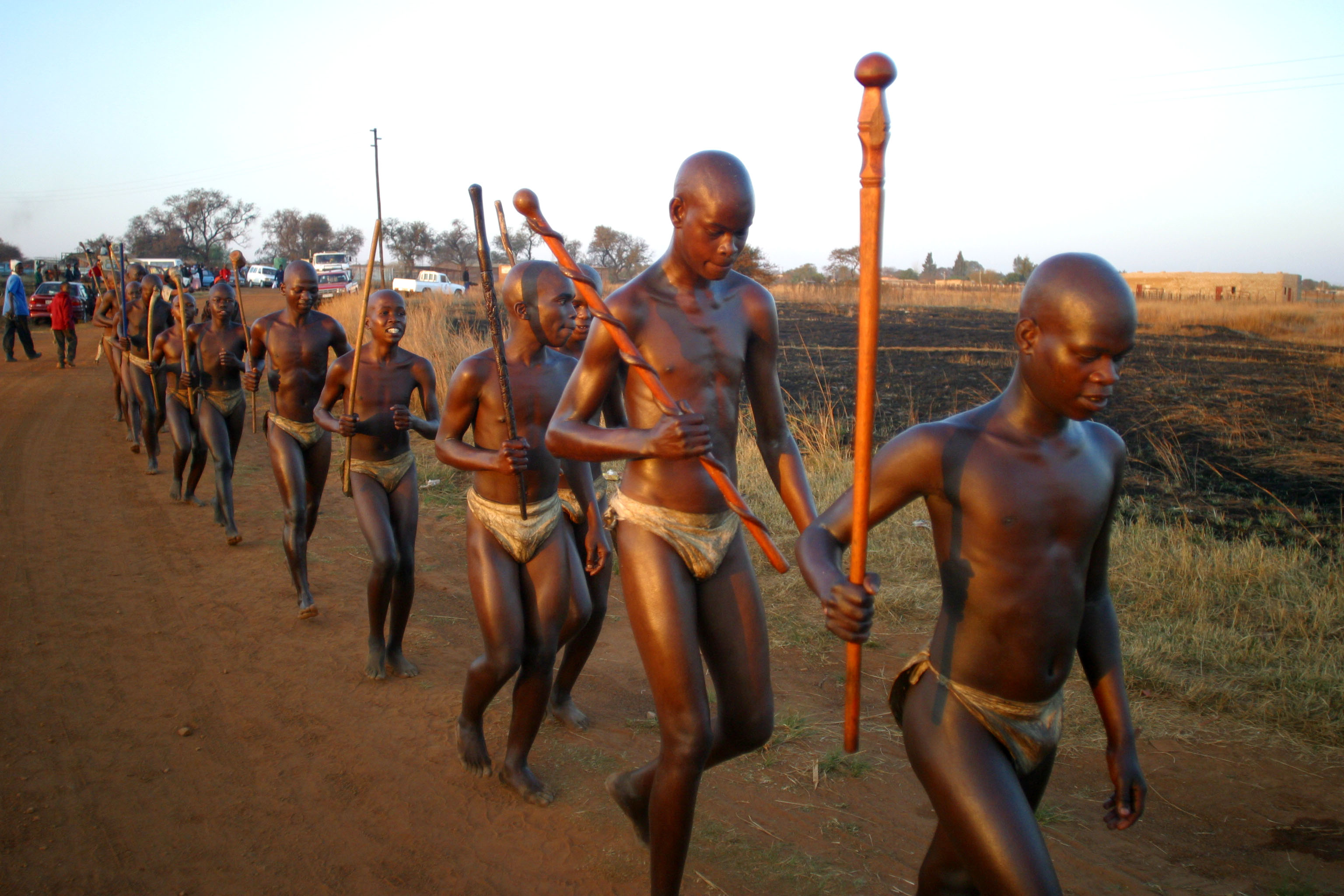Part of 150 new initiates of the Ndebele people in Mpumalanga , South Africa on 27th July 2006.The young men  aged between 18 to 34 were  in the bush for two months healing and learning as how assume the responsibilities of being a man.On this day they have come out to be presented to the community and be presented  with beads by the chief  after which they went back to their homes to assume responsibilty  in the community. The event takes place every four years but will have to be postponed in 2010 because of the world cup coming to South Africa.Photo Antony Kaminju/ Reuters