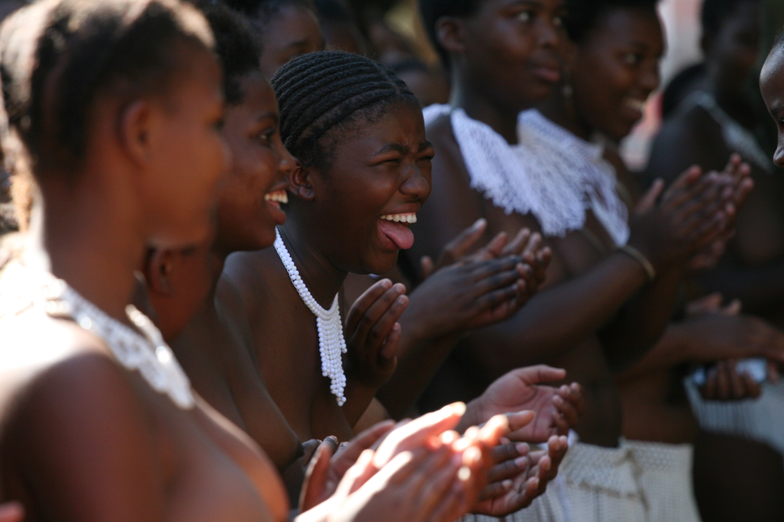 Teenage girls traditional songs after  undergoing a virginity test on sunday 18 February in Pietmaritzburtg town about 480 kilometers from Johnnesburg.There were 200 girls aged between 6 and 31 years who underwent the process and declared as virgins.Although human rights activists have been condemming this Zulu culture as demeaning and incorrect the women elders who carry it out have vowed that it must continue.They argue that it prevents the spread of HIV and also gives self esteem to those who are declared as virgins.Photo Antony Kaminju